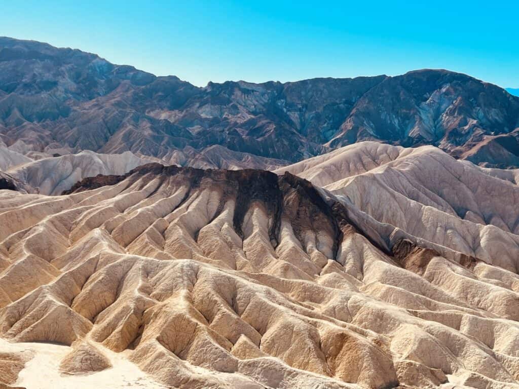 View of the Badlands and mountains at Zabriskie Point in Death Valley National Park
