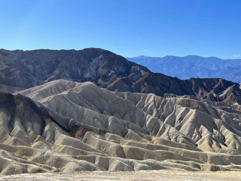 View of the Badlands and mountains at Zabriskie Point in Death Valley National Park