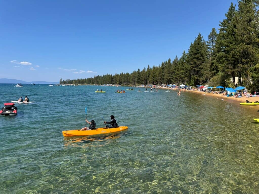 A yellow kayak in the shallow clear waters of Lake Tahoe