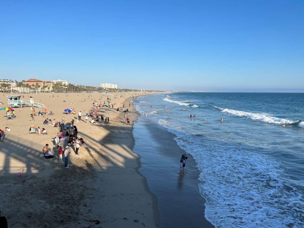 a wide sandy beach and ocean waves