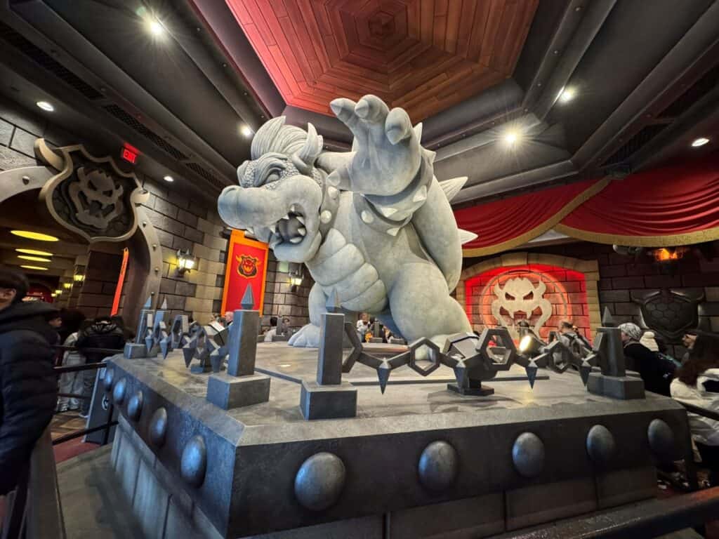 Bowser's statue in the queue area of Mario Kart ride