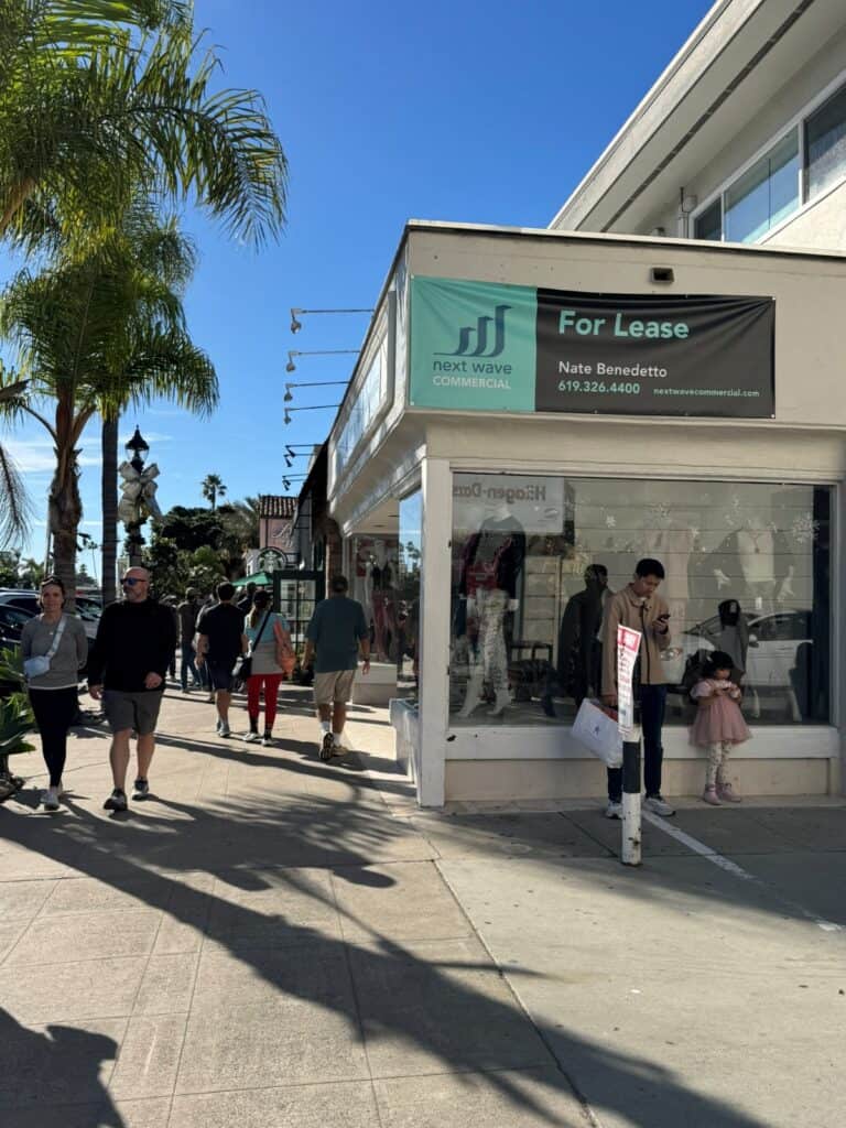 A busy sidewalk with shops, restaurants at La Jolla Village
